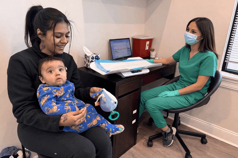 Doctor examining patient at urgent care
